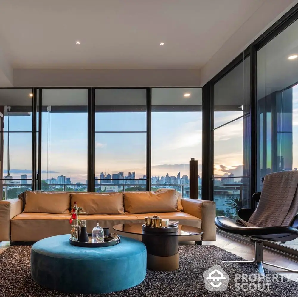 Luxurious living room with panoramic city view and modern furnishings.