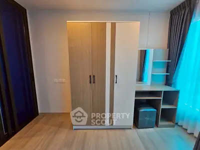 Modern bedroom with sleek wardrobe and stylish vanity set