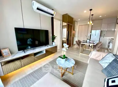 Modern living room with sleek decor, open layout, and stylish furniture in a contemporary apartment.