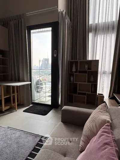 Modern living room with balcony view in high-rise apartment
