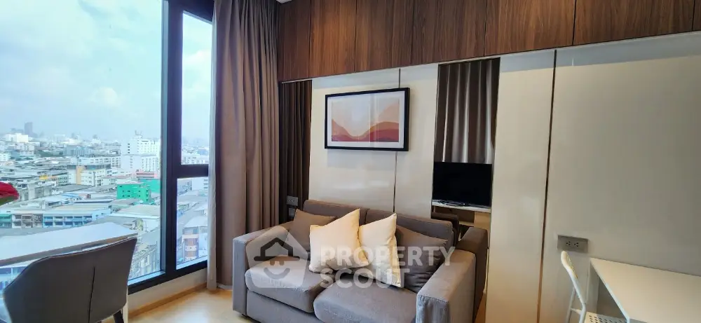 Modern living room with city view, stylish decor and cozy seating area