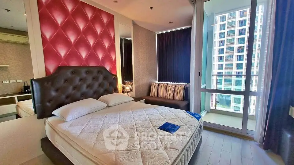 Luxurious bedroom with modern decor and city view balcony