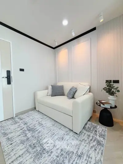 Chic modern living room with cozy white sofa and stylish decor