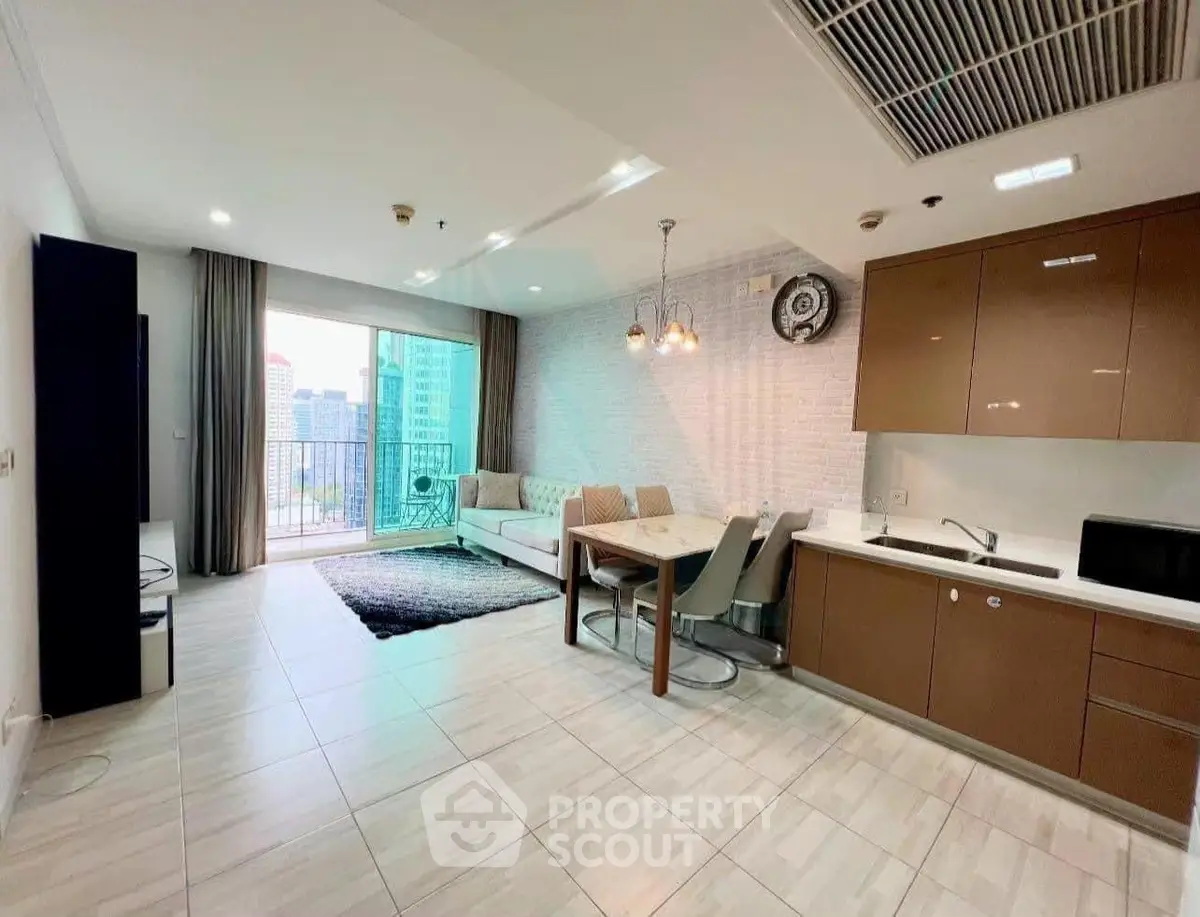 Modern open-layout living room and kitchen with city view balcony in luxury apartment.