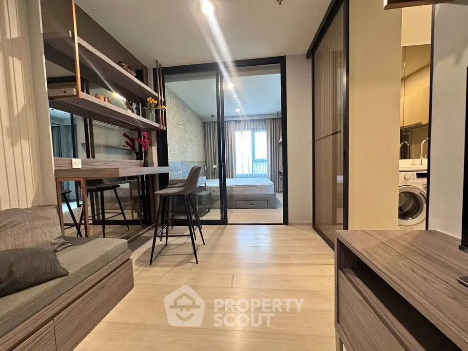 Modern apartment interior with open layout and stylish furnishings.