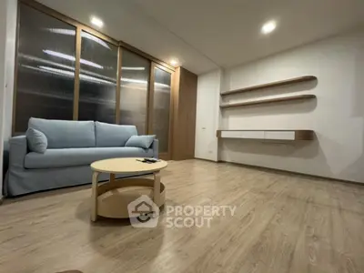 Modern living room with wooden flooring and minimalist furniture design