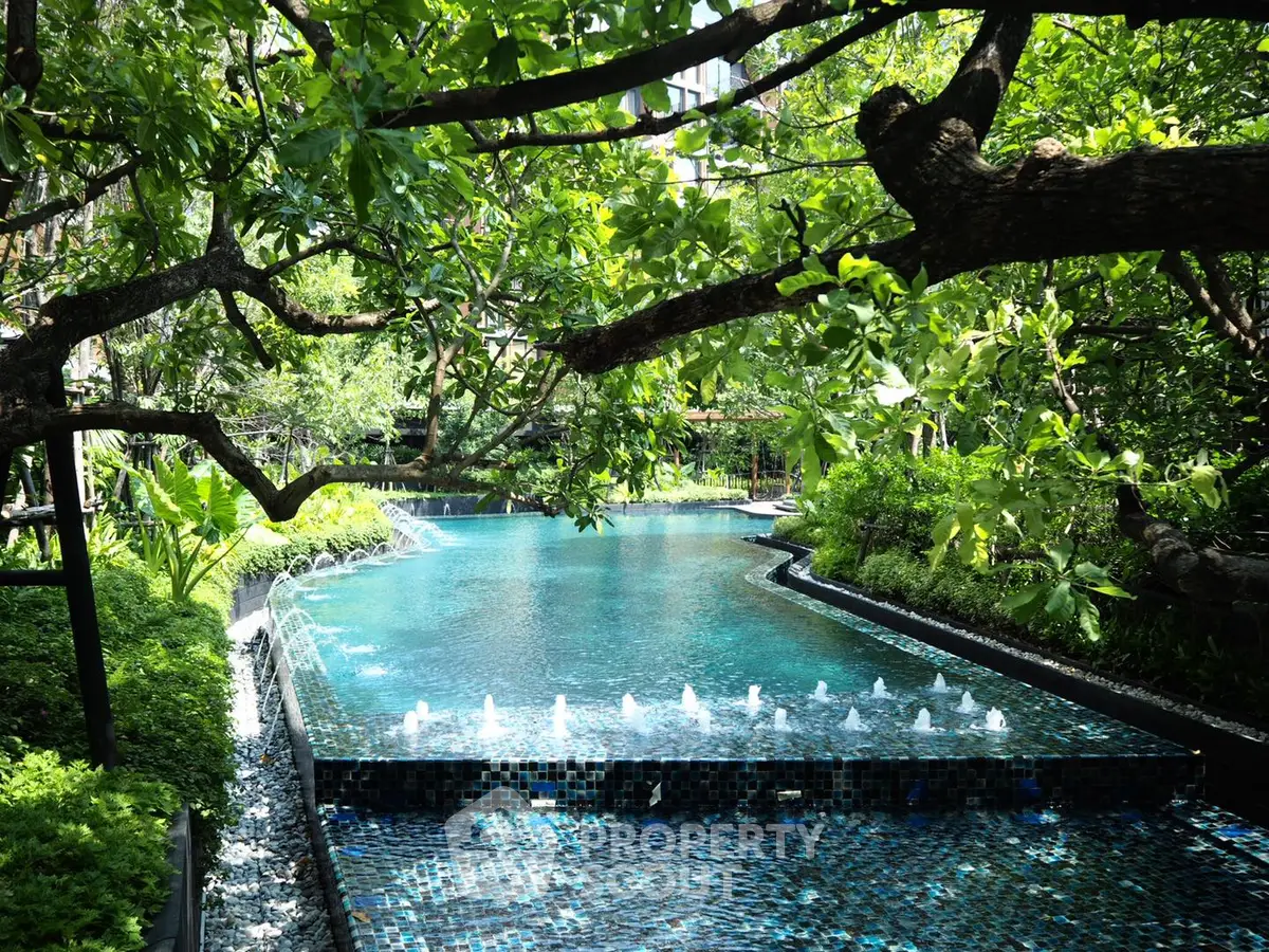 Luxurious garden pool with lush greenery and serene water features