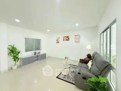 Spacious living room with modern decor and comfortable seating
