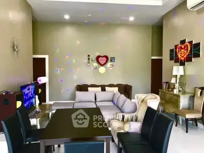 Spacious living room with modern decor and comfortable seating