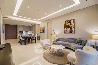 Luxurious modern living room with elegant furniture and open kitchen layout