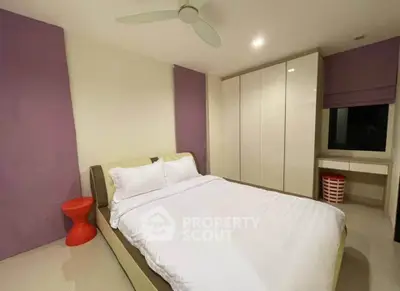 Modern bedroom with sleek design and ample storage space