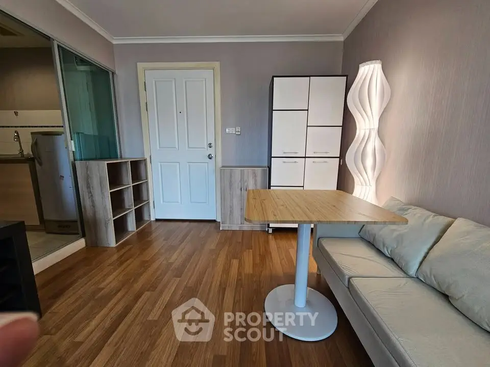 Modern living room with stylish furniture and wooden flooring