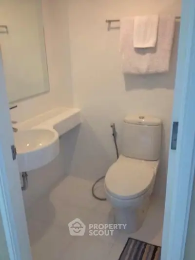 Compact modern bathroom with sleek fixtures and minimalist design