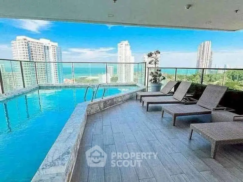 Luxurious rooftop pool with stunning city and ocean views, perfect for relaxation and leisure.