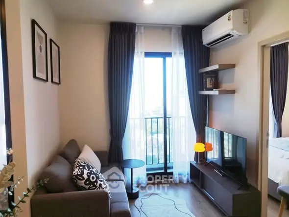 Cozy living room with modern decor and balcony view in stylish apartment