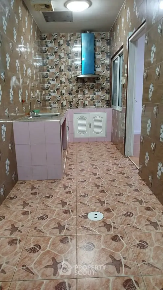 Charming kitchen with unique tile design and ample counter space