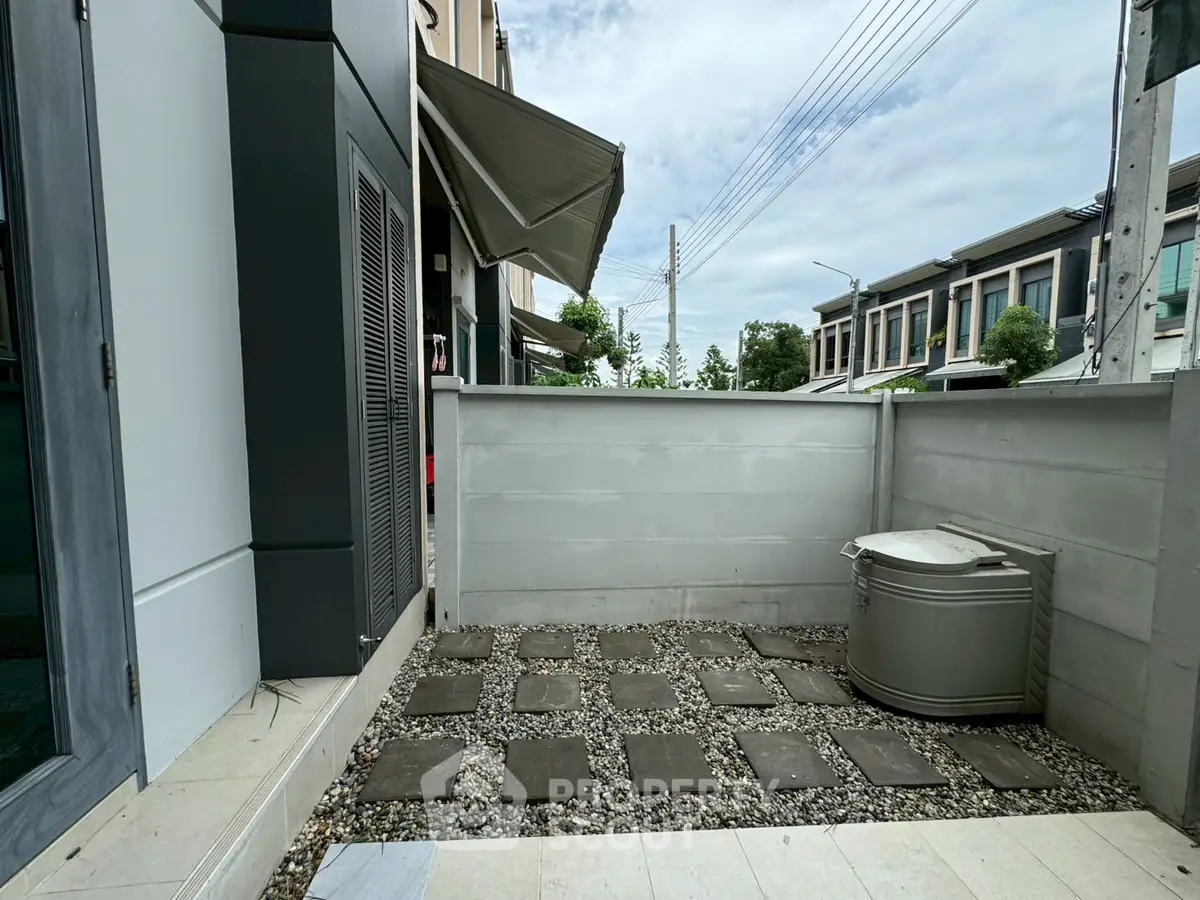 Modern outdoor patio with sleek design and stone pathway