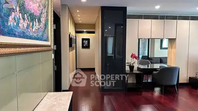Luxurious living room with elegant decor and hardwood floors in modern apartment.