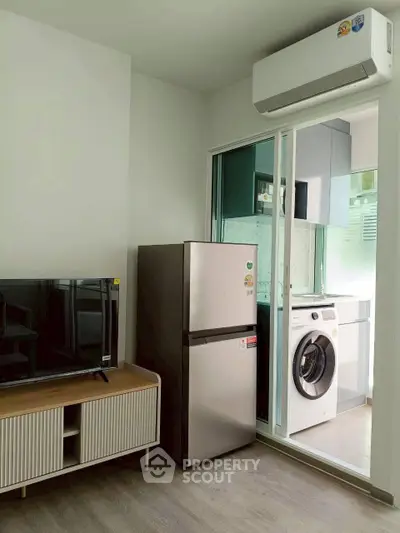 Modern apartment with sleek appliances and stylish furniture