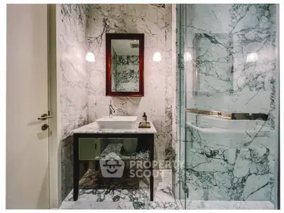Luxurious marble bathroom with elegant sink and mirror