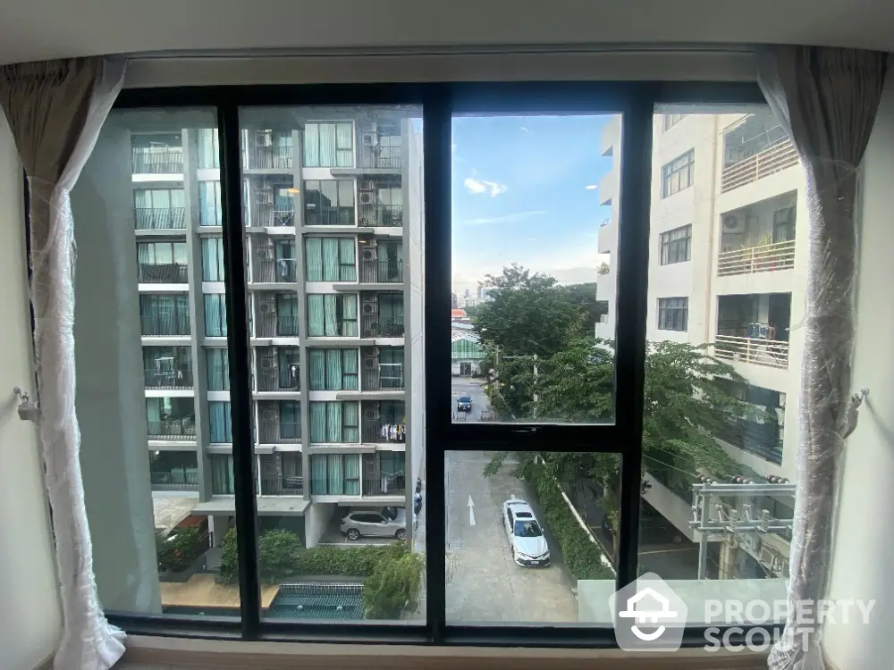 Spacious apartment window view overlooking modern urban landscape