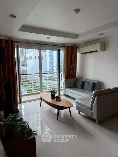 Modern living room with balcony view in urban apartment