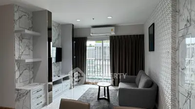 Modern living room with marble accents and balcony view