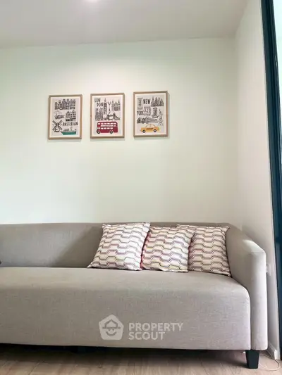 Modern living room with stylish sofa and wall art decor