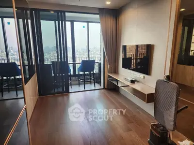 Modern living room with balcony and city view, featuring sleek wooden flooring and contemporary design.