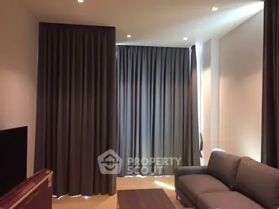 Modern living room with elegant curtains and cozy sofa