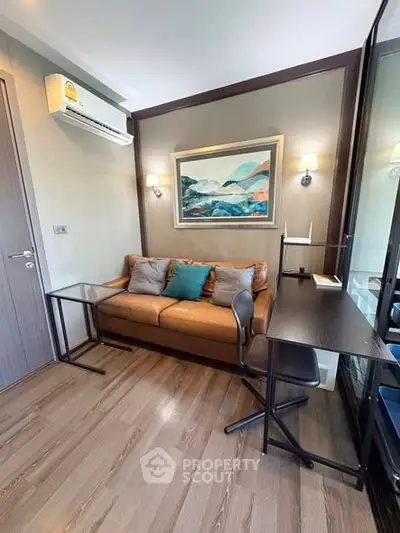 Modern living room with stylish decor and comfortable seating in a cozy apartment.