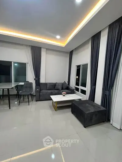 Modern living room with sleek furniture and ambient lighting