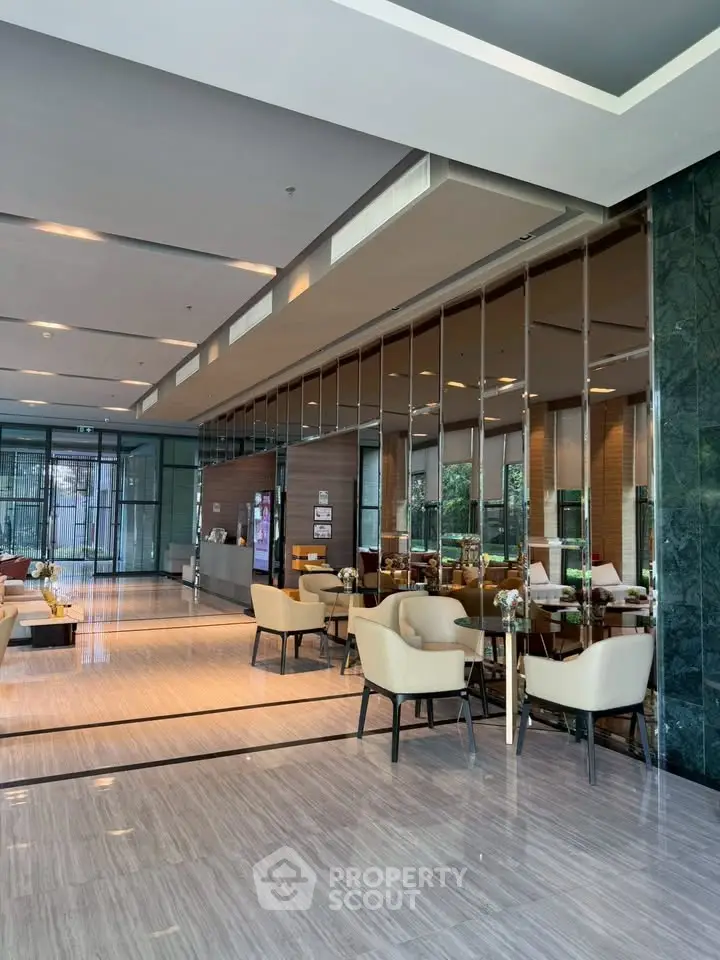 Luxurious modern lobby with elegant seating and stylish decor in a high-end residential building.