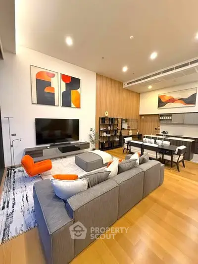 Spacious modern living room with open kitchen and stylish decor