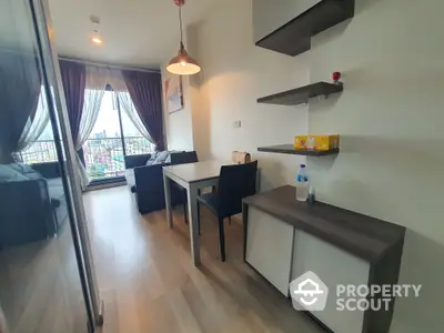 Modern apartment interior showcasing a sleek dining area with floating shelves, leading to a cozy living space with ample natural light and balcony access.