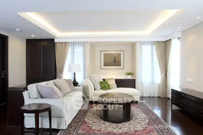 Luxurious living room with elegant furniture and ambient lighting, perfect for relaxation and entertainment.