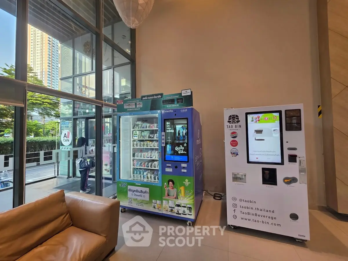 Modern building lobby with vending machines and seating area