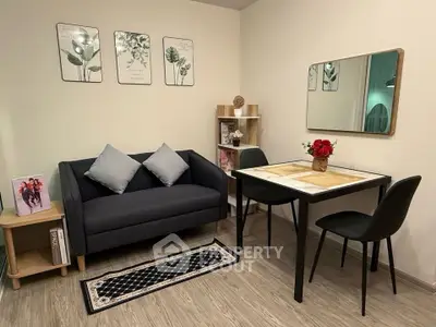 Cozy living room with modern decor and dining area, perfect for small gatherings.
