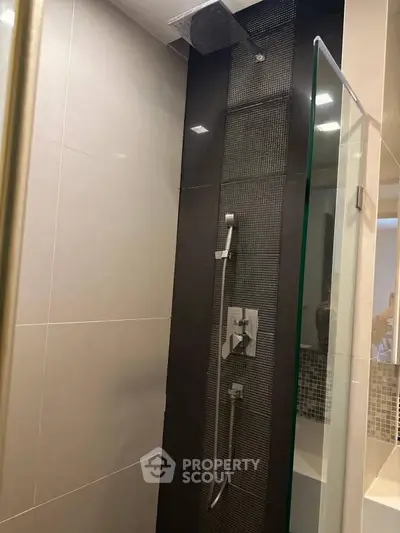 Modern bathroom shower with sleek design and glass door