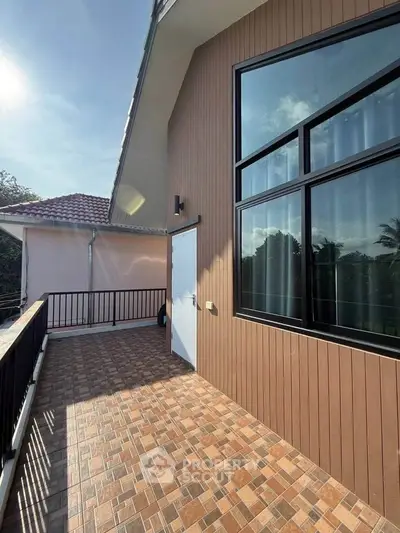 Spacious balcony with modern design and scenic view, perfect for relaxation and outdoor activities.