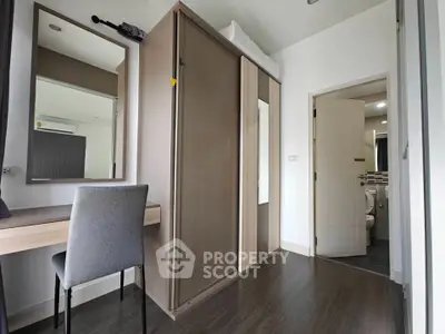 Modern bedroom with sleek wardrobe and stylish vanity desk