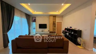 Spacious living room with modern decor and large windows for natural light.