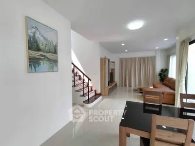 Spacious living room with modern furniture and natural light