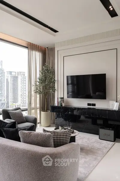 Luxurious modern living room with large window and city view, featuring elegant furniture and sleek TV setup.