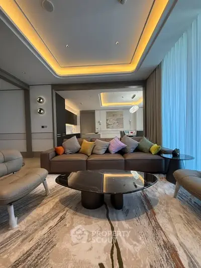 Luxurious modern living room with stylish furniture and ambient lighting, perfect for relaxation and entertainment.