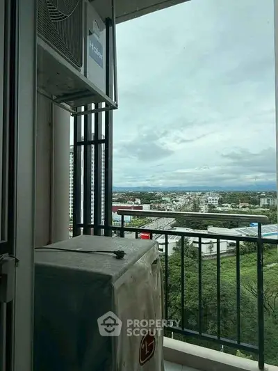 Stunning balcony view overlooking cityscape and greenery, perfect for relaxation and enjoying the outdoors.
