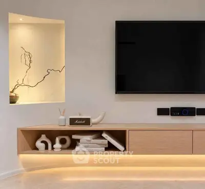 Modern living room with sleek TV setup and elegant decor