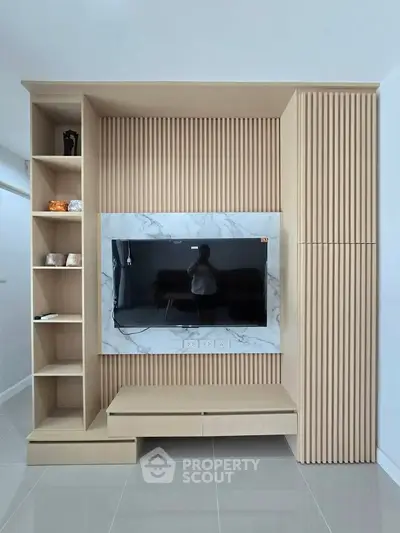 Modern living room with stylish wooden TV wall unit and marble accents