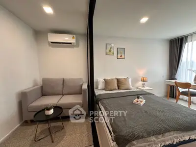 Modern bedroom with cozy sofa and stylish decor in a bright apartment