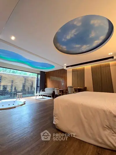 Luxurious bedroom with unique ceiling design and private jacuzzi, perfect for relaxation.